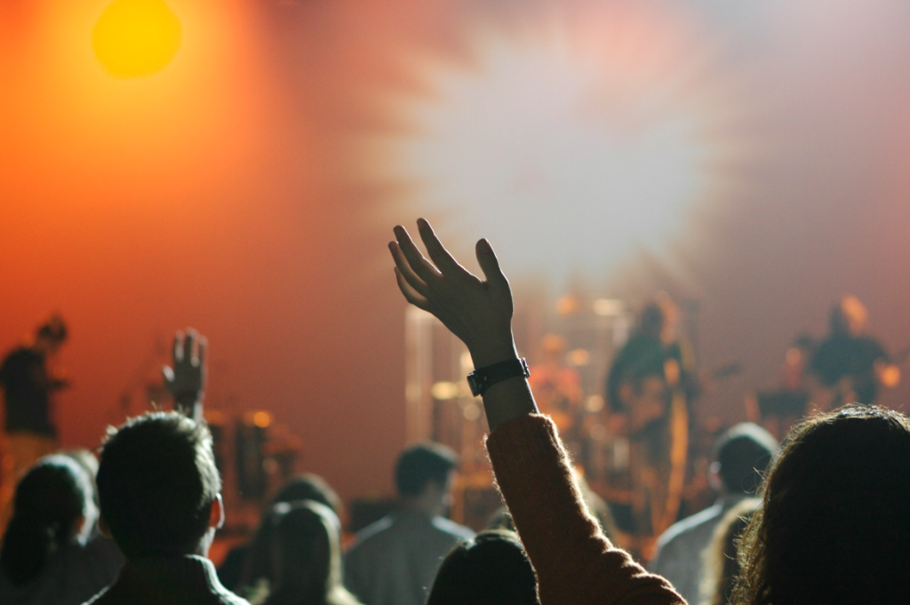 Worshippers raising hands in praise